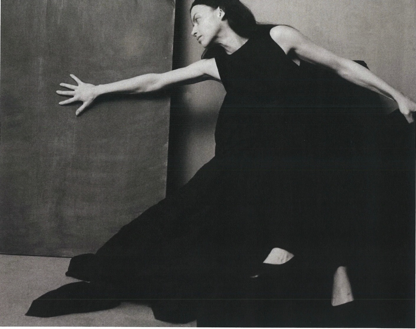 TANYA CHURSINA — figure in black reaching across a painted canvas