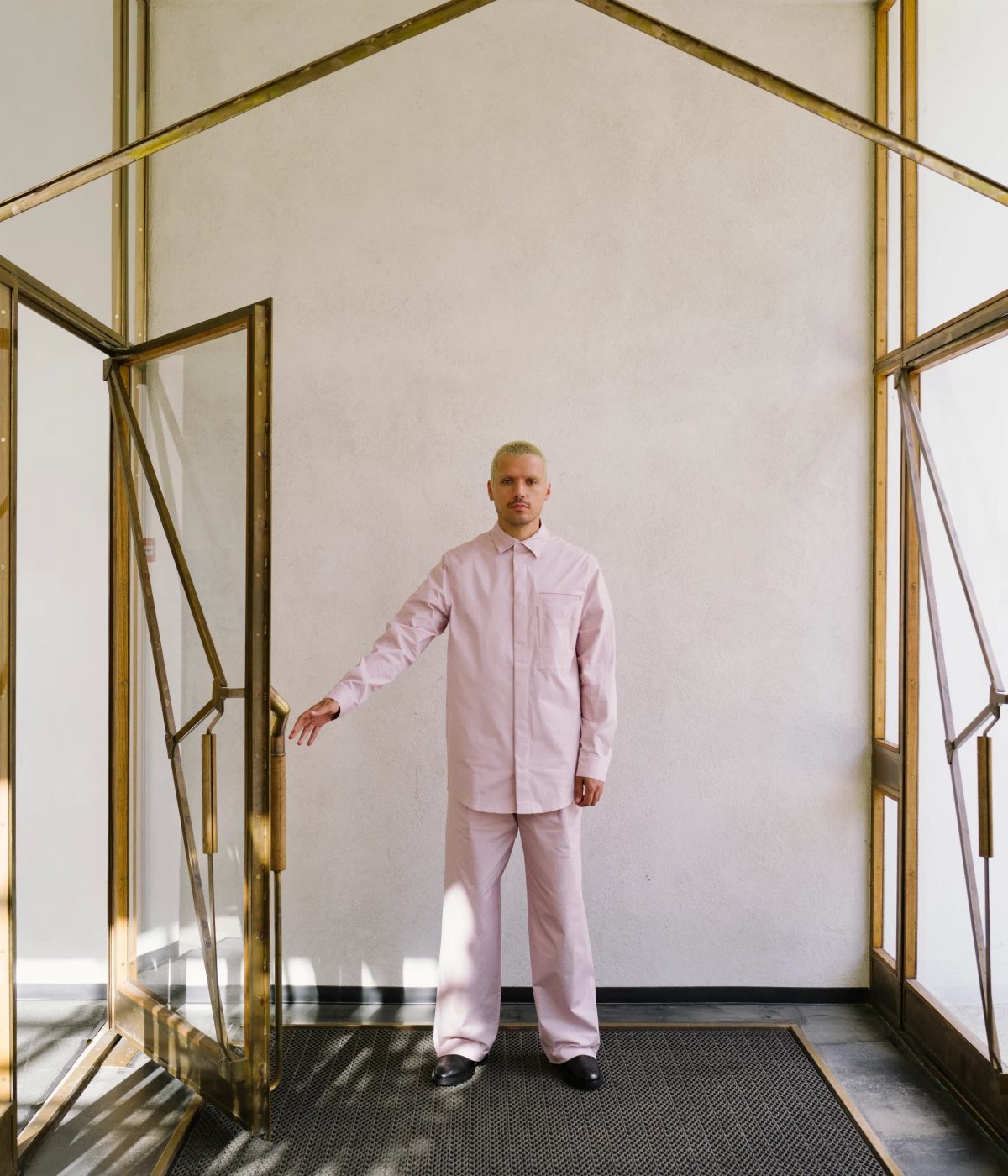 COS — figure in ivory rib knit in a wood-panelled room