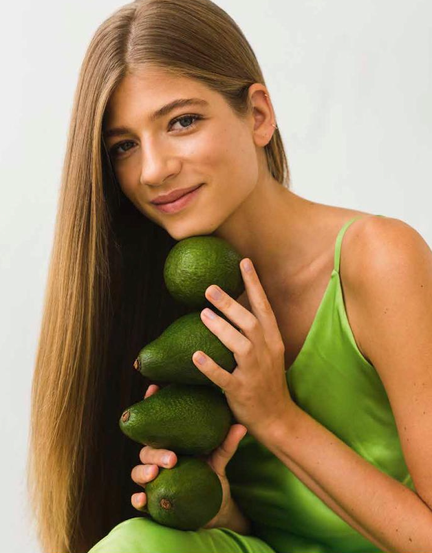 HOW TO EAT — portrait with a column of avocados