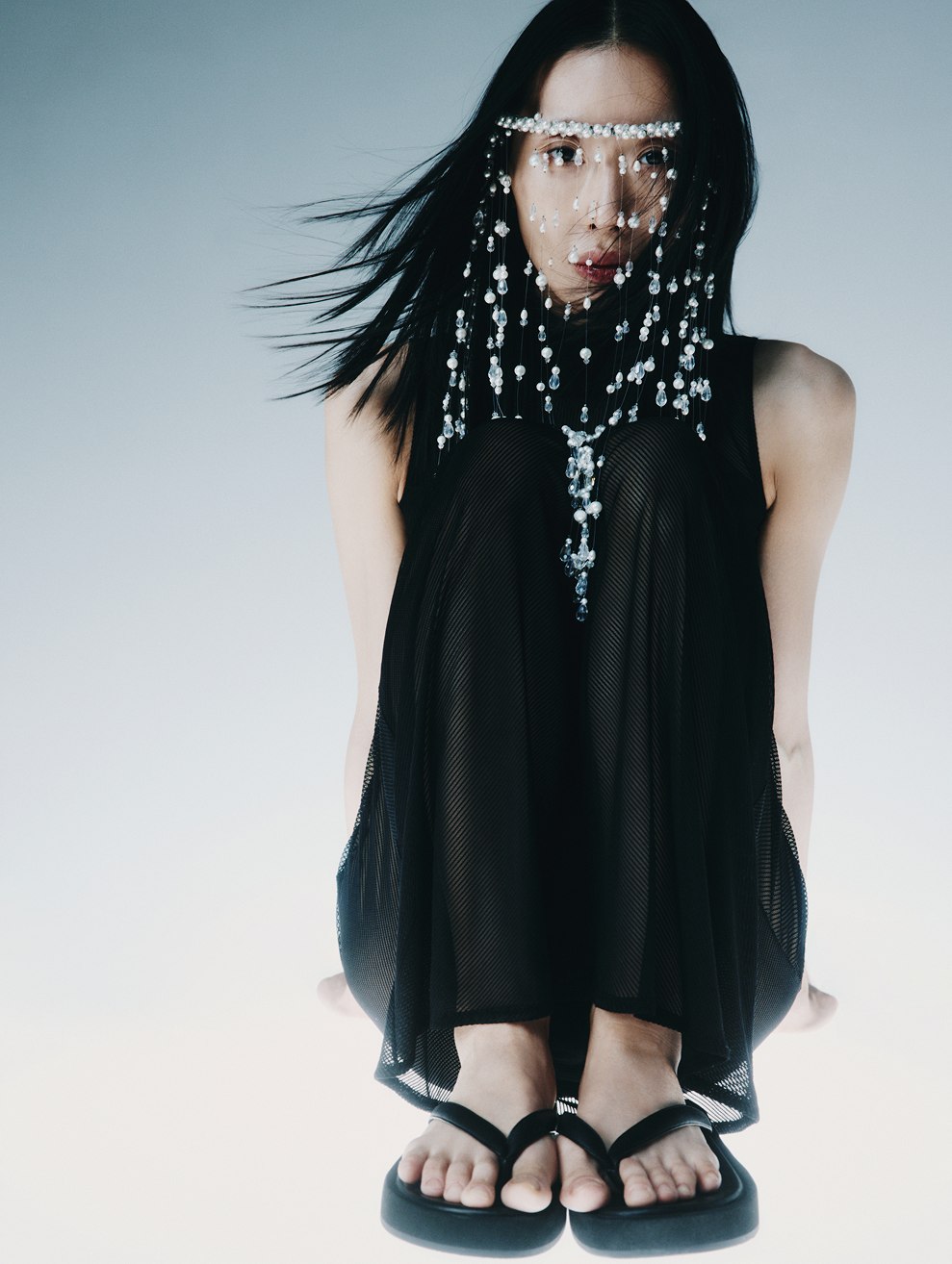 MIOGI LI — portrait with a pearl face veil, black mesh dress