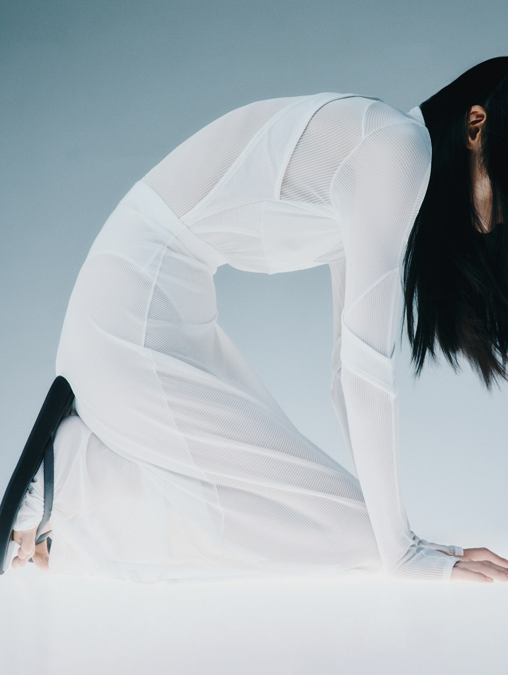 MIOGI LI — white sheer dress, kneeling figure