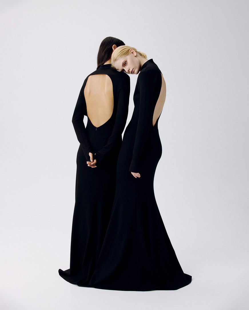 MIOGI LI — two backless black gowns on a pale ground