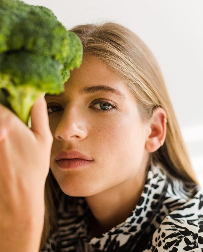 Beauty editorial — portrait behind a broccoli floret