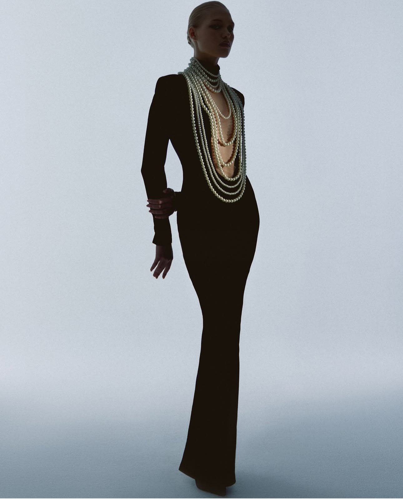 KAMILLA PURSHIE — black gown with cascading pearl strands
