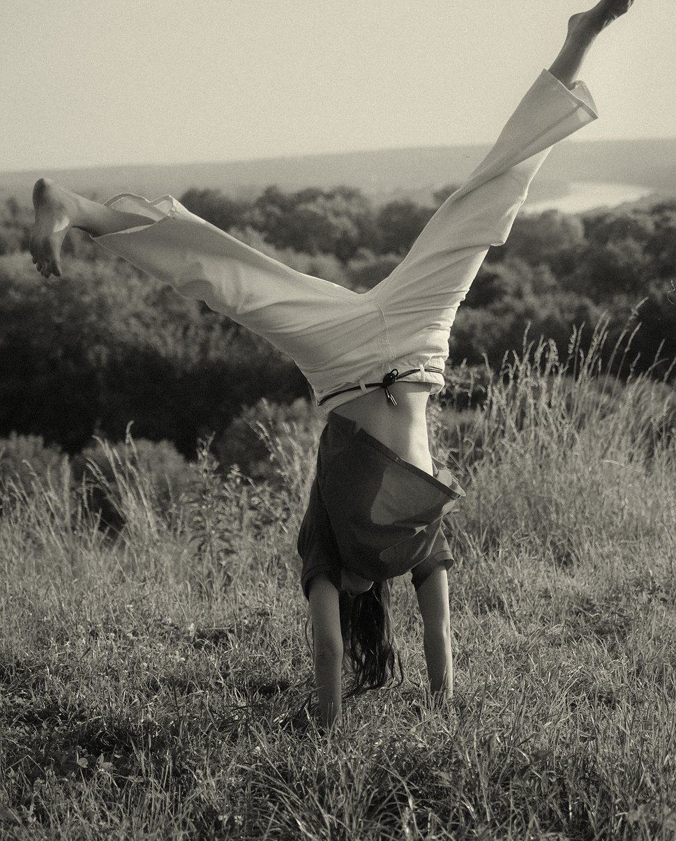 SHU SHA — cartwheel in a summer field above the river, on film